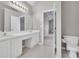 Spacious bathroom with dual sinks, toilet and access to main bedroom at 2061 Emerald Dr, Loganville, GA 30052