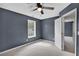Attic bedroom featuring vaulted ceilings, carpet and a ceiling fan at 2061 Emerald Dr, Loganville, GA 30052