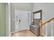 Bright foyer with hardwood floors, a hall tree, and a view of the front door at 2061 Emerald Dr, Loganville, GA 30052