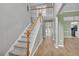 Open foyer with stairs, hardwood floors, and views into other rooms at 2061 Emerald Dr, Loganville, GA 30052