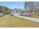 Inviting two-story home with gray siding, attached garage, and driveway at 2061 Emerald Dr, Loganville, GA 30052