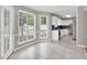 Open kitchen and dining area with white cabinets and views of the backyard at 2061 Emerald Dr, Loganville, GA 30052
