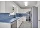 Well-lit kitchen with stainless steel appliances, sleek countertops, and ample cabinet space at 2061 Emerald Dr, Loganville, GA 30052