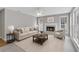 Cozy living room with a fireplace, neutral walls, and plush seating, perfect for relaxing at 2061 Emerald Dr, Loganville, GA 30052