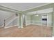 Spacious living room with hardwood floors and easy access to the kitchen and foyer at 2061 Emerald Dr, Loganville, GA 30052