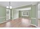 Hardwood floors, natural light and neutral walls create a comfortable living space at 2061 Emerald Dr, Loganville, GA 30052
