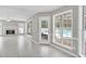 Large living area featuring a fireplace, tile flooring, and a view of the outdoor pool at 2061 Emerald Dr, Loganville, GA 30052