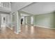 Open-concept living area with hardwood floors and neutral paint colors at 2061 Emerald Dr, Loganville, GA 30052