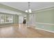 Open floor plan with hardwood floors in the living room, foyer, and dining area at 2061 Emerald Dr, Loganville, GA 30052