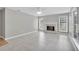 Bright living room with fireplace and large windows, perfect for relaxing or entertaining at 2061 Emerald Dr, Loganville, GA 30052