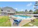 Backyard pool with lounge chairs and an outdoor living space, perfect for entertaining at 2061 Emerald Dr, Loganville, GA 30052