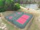 Aerial view of tennis and basketball courts, offering a recreational space for sports enthusiasts at 2061 Emerald Dr, Loganville, GA 30052