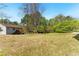 Expansive backyard with mature trees and level lawn; perfect for outdoor enjoyment and activities at 3267 Forrest Bluff Way, Lithonia, GA 30038