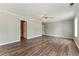 Bright bedroom featuring wood-look floors and large windows, creating a welcoming atmosphere at 3267 Forrest Bluff Way, Lithonia, GA 30038