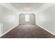 Expansive bonus room with neutral paint, carpeted floors, and ample space; perfect for relaxing at 3267 Forrest Bluff Way, Lithonia, GA 30038
