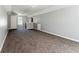Open bonus room with ample natural light, neutral carpet, and grey walls; an airy space at 3267 Forrest Bluff Way, Lithonia, GA 30038