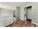 Open dining area featuring wood floors and modern lighting at 3267 Forrest Bluff Way, Lithonia, GA 30038