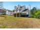 Exterior showcasing the home's design, landscaping, and surrounding greenery at 3267 Forrest Bluff Way, Lithonia, GA 30038