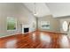 Spacious living room with vaulted ceiling, fireplace, and hardwood floors at 3267 Forrest Bluff Way, Lithonia, GA 30038
