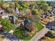Aerial view of a two-story home with a beautifully landscaped front yard on a tree-lined street at 405 N Pine Dr, Alpharetta, GA 30022