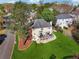 Aerial view of a two-story home featuring a large lawn and deck at 405 N Pine Dr, Alpharetta, GA 30022