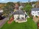 Aerial view of a two-story home featuring a spacious backyard and a large deck at 405 N Pine Dr, Alpharetta, GA 30022
