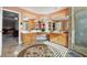 Bathroom with marble tile, a makeup vanity, and a double sink setup at 405 N Pine Dr, Alpharetta, GA 30022