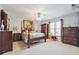 Charming bedroom with a ceiling fan, colorful decorations, and ample closet space at 405 N Pine Dr, Alpharetta, GA 30022