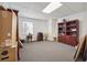 Bonus room featuring wall-to-wall carpet, one window, and built in wooden cabinets at 405 N Pine Dr, Alpharetta, GA 30022