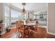 Cozy dining room next to the kitchen featuring a modern chandelier and large bright window at 405 N Pine Dr, Alpharetta, GA 30022