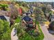 Beautiful exterior of a well-maintained brick home with a landscaped front yard and mature trees on a sunny day at 405 N Pine Dr, Alpharetta, GA 30022