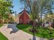 Well-maintained lawn and long driveway leading to a beautiful brick home with lush greenery at 405 N Pine Dr, Alpharetta, GA 30022