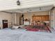 Garage with rugs, storage, an extra refrigerator, and overhead lights and door at 405 N Pine Dr, Alpharetta, GA 30022