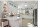 Beautiful white kitchen with stainless steel appliances, stone countertops, and ample storage at 405 N Pine Dr, Alpharetta, GA 30022