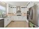Well-equipped kitchen with stainless steel appliances, marble backsplash, and plenty of counter space at 405 N Pine Dr, Alpharetta, GA 30022