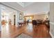 Spacious living room showcasing hardwood floors, elegant furniture, and a seamless transition to the dining area at 405 N Pine Dr, Alpharetta, GA 30022