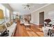 Open floor plan with hardwood floors connecting the living room to the kitchen and dining area at 405 N Pine Dr, Alpharetta, GA 30022