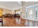 Grand living room featuring hardwood floors, a high ceiling, and a bright entryway at 405 N Pine Dr, Alpharetta, GA 30022