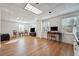 This home has a spacious living room, with hardwood floors, windows and ceiling lights at 405 N Pine Dr, Alpharetta, GA 30022