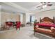 Spacious main bedroom suite with sitting area, a fireplace, and a large bed at 405 N Pine Dr, Alpharetta, GA 30022