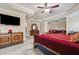 Large main bedroom with sitting area, fireplace, and large furniture pieces at 405 N Pine Dr, Alpharetta, GA 30022