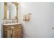 Elegant powder room with ornate vanity and decorative mirror, perfect for guests at 405 N Pine Dr, Alpharetta, GA 30022