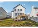 Backyard with grass and a deck attached to the home at 7902 West Shore Cir, Riverdale, GA 30296