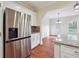Modern kitchen showcases stainless steel appliances, white cabinets, and granite countertops with a mosaic backsplash at 7902 West Shore Cir, Riverdale, GA 30296
