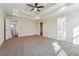 Spacious main bedroom features tray ceilings, an ensuite bath, and a walk-in closet providing ample space at 7902 West Shore Cir, Riverdale, GA 30296