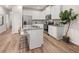 Modern kitchen featuring white cabinets, stainless steel appliances, and a breakfast bar at 1326 Riverstone Rd, Jonesboro, GA 30238