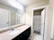 Bathroom with single sink, granite counters, tile flooring, and access to the shower at 2050 Harvest Ridge Cir, Buford, GA 30519