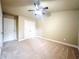 Comfortable bedroom featuring neutral walls, carpet flooring, and ample closet space at 2050 Harvest Ridge Cir, Buford, GA 30519