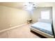 Bedroom with neutral walls, carpet flooring, and a ceiling fan for added comfort at 2050 Harvest Ridge Cir, Buford, GA 30519