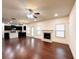 Bright and open living room with a fireplace, hardwood floors, and abundant natural light at 2050 Harvest Ridge Cir, Buford, GA 30519